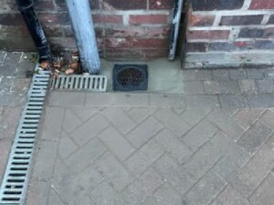 Finished gully replacement in Bury with the area reinstated neatly around the new gully grate.