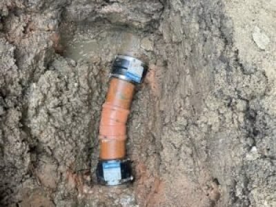 Drain pipe repair in Oldham with new section and couplings fitted
