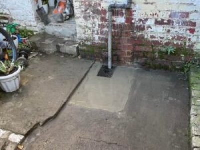 Completed new gully with fresh concrete surround at a property in Salford, Greater Manchester.