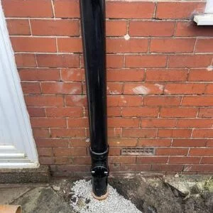 Repaired soil stack connection with gravel bedding ready for reinstatement