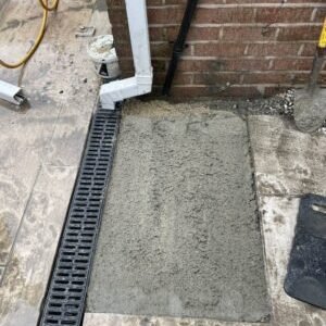 blocked drain being repaired in Greater Manchester
