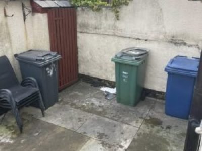 Rear yard area during a drain repair job to stop recurring blockages in Manchester