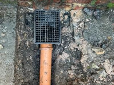 New gully installation with underground drainage connection in Salford, Greater Manchester.