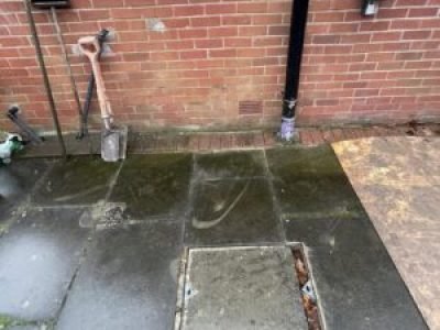 Completed drainage repair with access cover and new vent pipe in Rochdale.