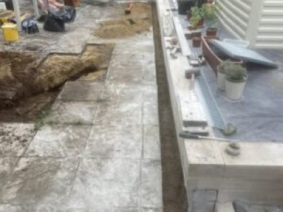 Trench excavation and preparation for 9m ACO channel drain installation in Sale, Trafford.