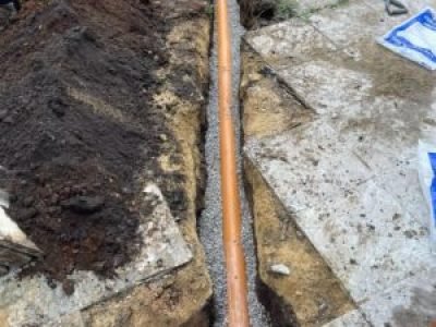 New underground pipe run installed to connect 9m ACO channel drain system in Sale, Trafford.