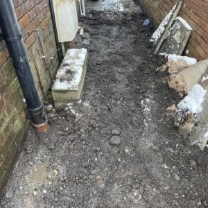 Trench backfilled after installing new underground drainage run