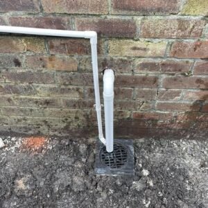 New yard gully and pipe connection installed at a Greater Manchester property