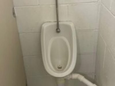 Urinal unblocked with pipework reconnected and tested at a Ford site in Stockport.