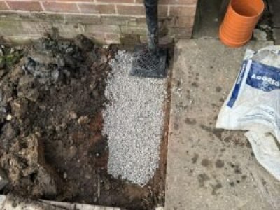 New rainwater gully installed and connected to underground drainage in Tameside.