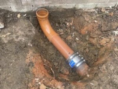 New underground soil pipe connection installed during drainage works in Tameside.
