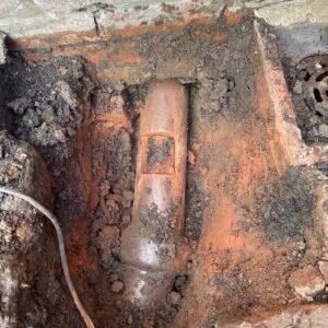 blocked toilet pipe being repaired in greater manchester