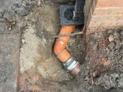 New underground gully connection and pipework installed during repair in Wigan.